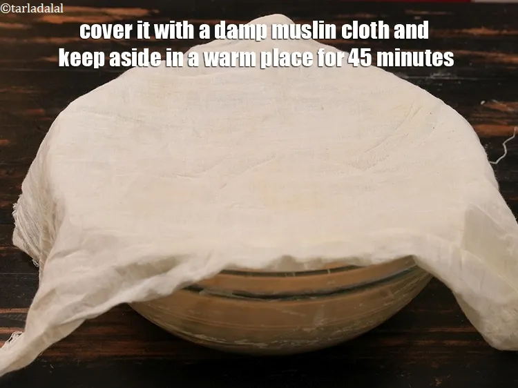 Step 19 – Cover it with a damp muslin cloth and keep aside in a warm place for …
