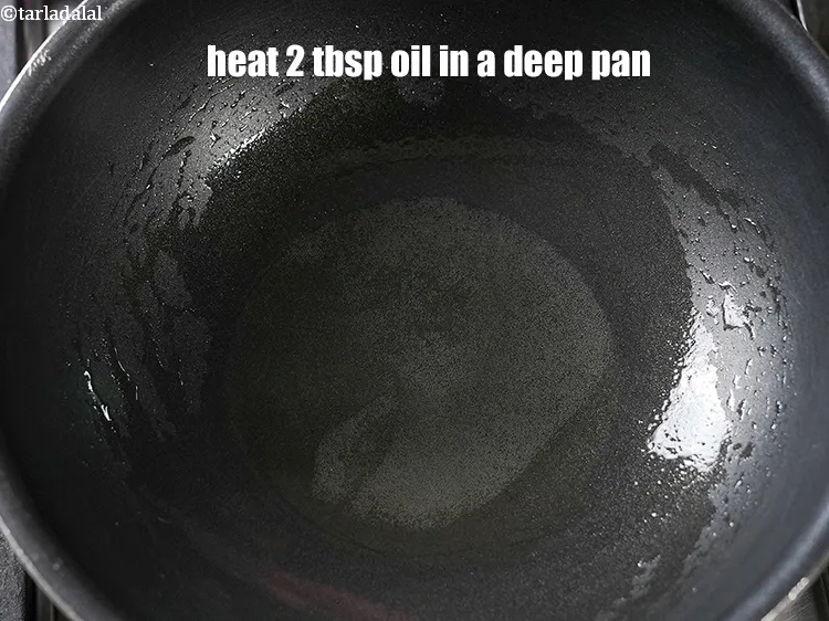 Step 15 – To make <strong>egg curry recipe</strong>, heat 2 tbsp oil in a deep pan.