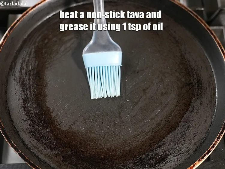 Step 14 – Heat a non-stick tava (griddle) and grease it using 1 tsp of oil.