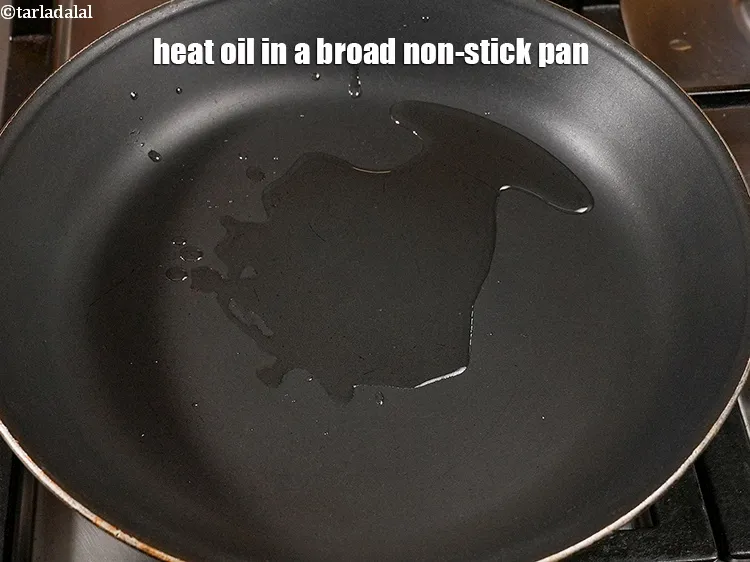 Step 15 – Heat 1 tbsp <a href="https://www.tarladalal.com/glossary-oil-671i">oil</a> in a broad non-stick pan.