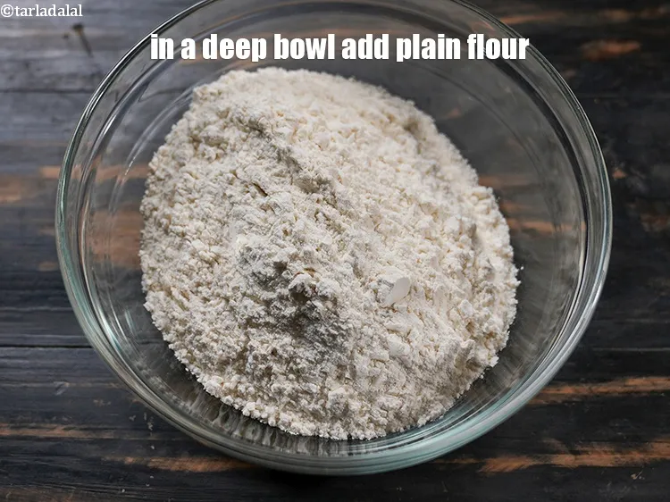 Step 15 – To make <strong>paneer kulcha</strong>, in a deep bowl add 2 cups <a href="https://www.tarladalal.com/glossary-plain-flour-maida-188i">plain flour (maida)</a>.