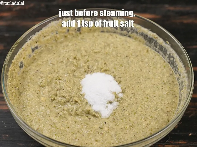 Step 23 – <meta charset="UTF-8" /> Just before steaming, add 1&nbsp;tsp of <a href="https://www.tarladalal.com/glossary-fruit-salt-420i">fruit salt</a>.
