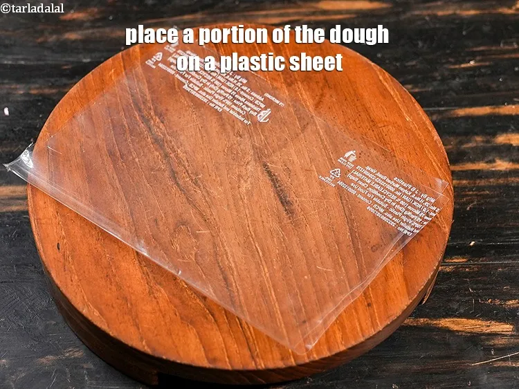 Step 15 – Place a portion of the dough on a plastic sheet.