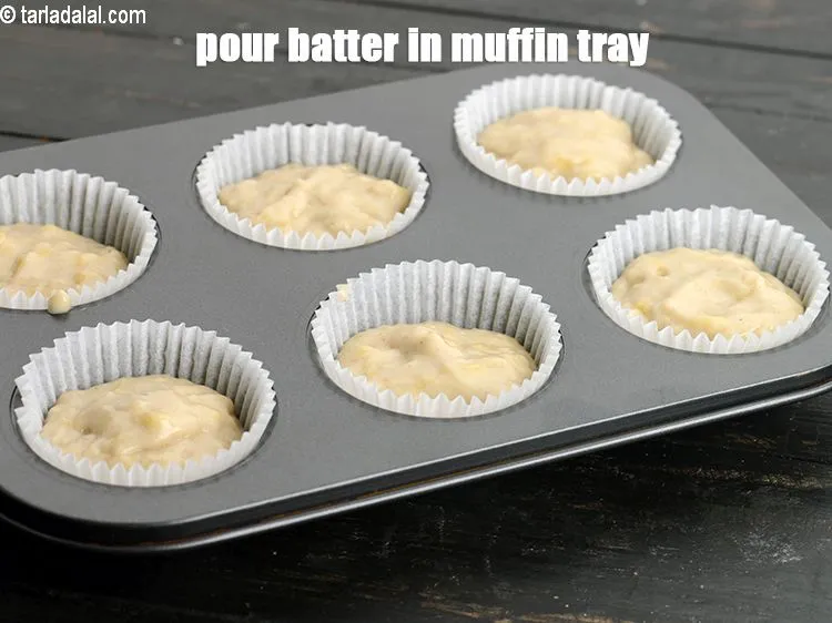 Step 15 – Pour equal quantities of batter in a lined muffin tray. Tap it twice to remove …