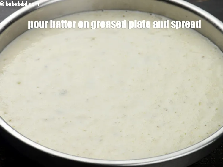 Step 16 – Pour the batter on greased plate and spread it evenly.