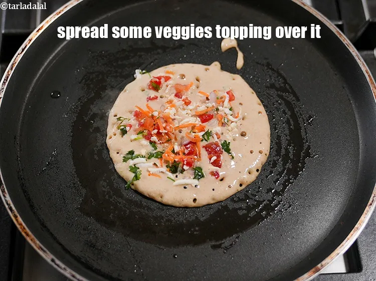 Step 22 – Spread some veggies topping over it and press it gently.
