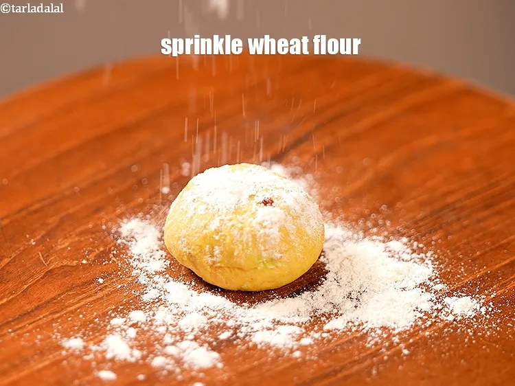Step 15 – Sprinkle little whole wheat flour.