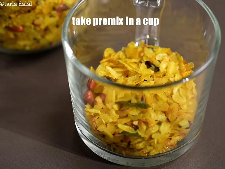 Step 15 – To make 1 serving, take &frac12; cup of the instant poha premix in a cup.