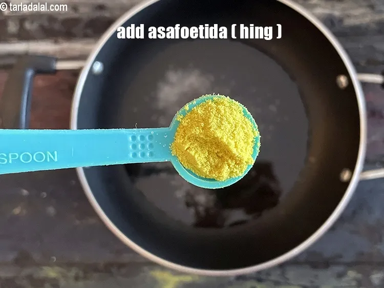 Step 16 – Add&nbsp;<meta charset="UTF-8" />1/2 tsp&nbsp;<a href="glossary-asafoetida-hing-113i">asafoetida (hing)</a>.