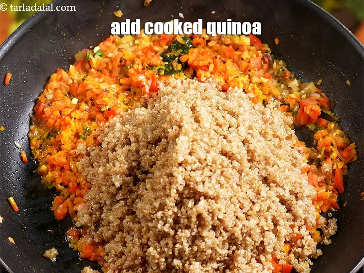 Step 15 – Add 3 cups <a href="https://www.tarladalal.com/glossary-cooked-quinoa-2396i">cooked quinoa</a>.