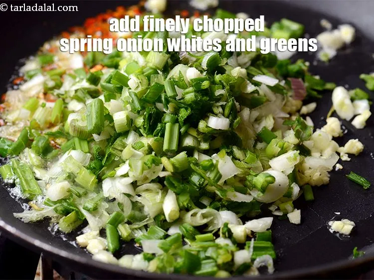 Step 15 – Add &frac12; cup finely chopped spring onion whites and greens.