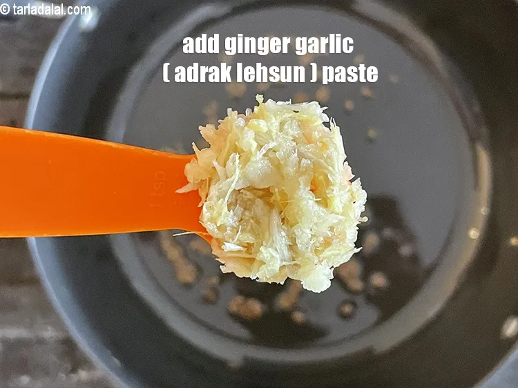 Step 25 – Add&nbsp;<meta charset="UTF-8" />1 tsp&nbsp;<a href="glossary-ginger-garlic-paste-adrak-lehsun-ki-pate-adrak-lahsun-ki-paste-939i">ginger-garlic (adrak-lehsun) paste</a>.