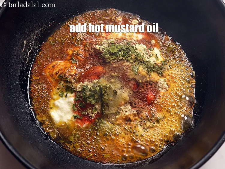 Step 15 – Add 3 tbsp hot&nbsp;<a href="https://www.tarladalal.com/glossary-mustard-oil-rai-ka-tel-sarson-ka-tel-942i" target="_blank">mustard (rai / sarson) oil</a>.