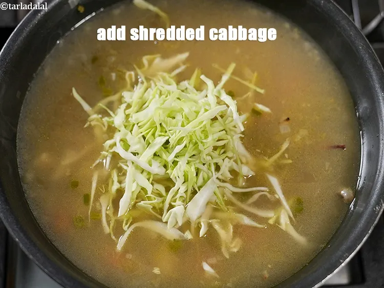 Step 21 – Add&nbsp;<meta charset="UTF-8" />1/3 cup&nbsp;<a href="glossary-shredded-cabbage-763i">shredded cabbage</a>.