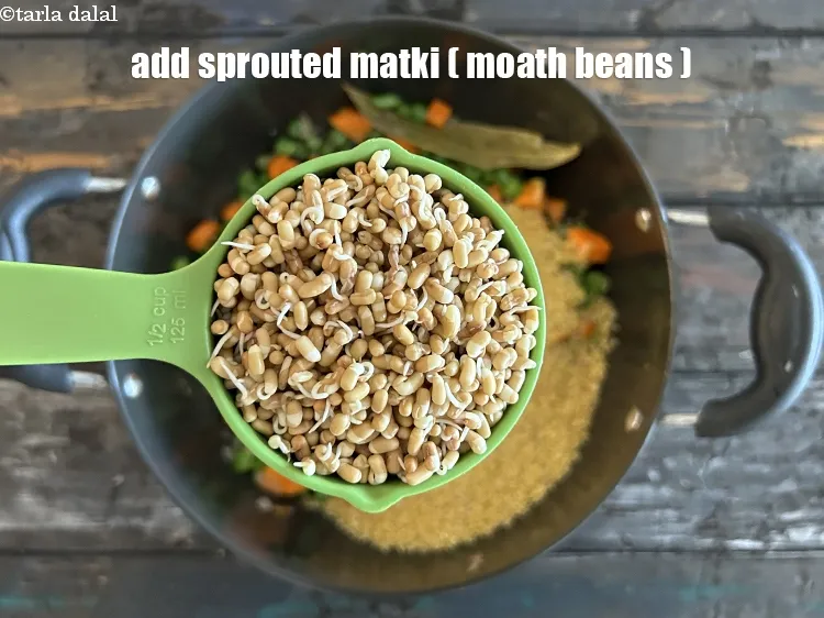 Step 15 – Add&nbsp;<meta charset="UTF-8" />1/2 cup&nbsp;<a href="glossary-sprouted-matki-matki-sprouts-ankurit-matki-417i">sprouted matki (moath beans)</a>.
