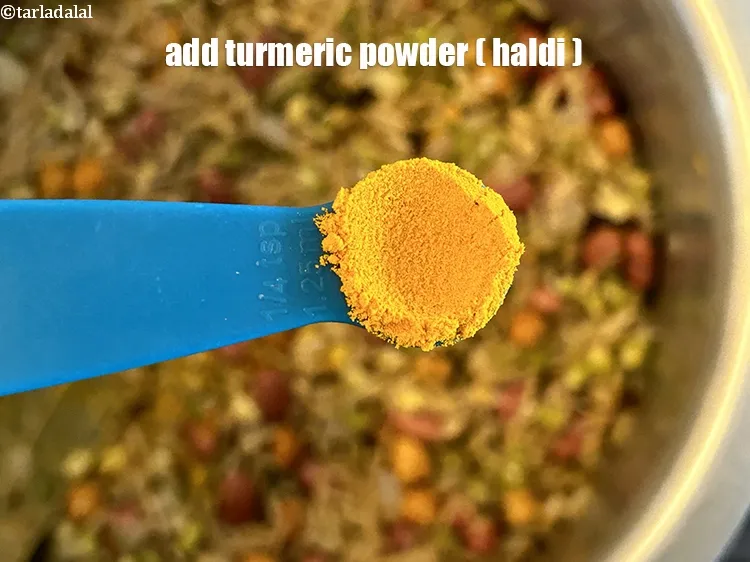 Step 23 – Add&nbsp;<meta charset="UTF-8" />1/4 tsp&nbsp;<a href="glossary-turmeric-powder-haldi-645i">turmeric powder (haldi)</a>.