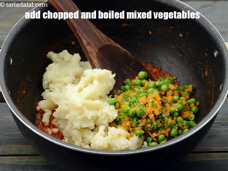 Step 20 – Add 3/4 cup&nbsp;finely&nbsp;<a href="https://www.tarladalal.com/glossary-chopped-and-boiled-mixed-vegetables-1884i">chopped and boiled mixed vegetables</a>.