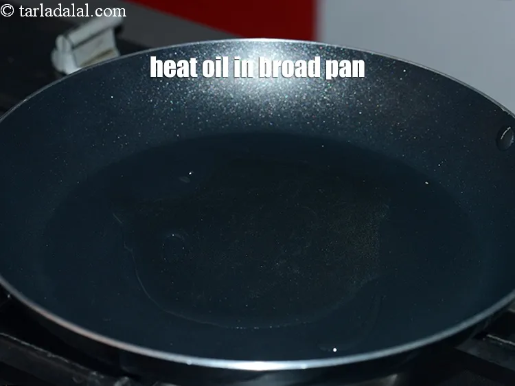 Step 16 – Heat 1 tbsp&nbsp;<a href="https://www.tarladalal.com/glossary-oil-671i">oil</a> in a broad non-stick pan.