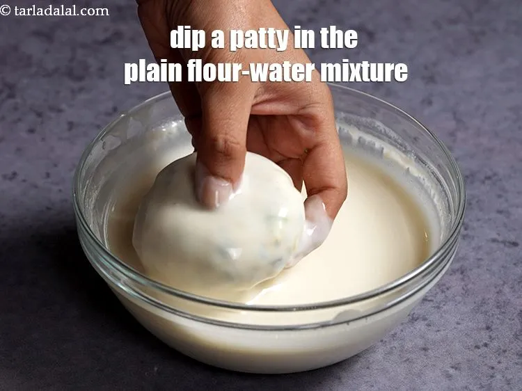 Step 20 – Dip a patty in the plain flour-water mixture. See how to make plain flour-water mixture …