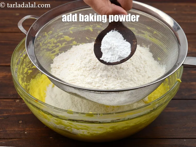 Step 16 – Add 2 tsp&nbsp;<a href="https://www.tarladalal.com/glossary-baking-powder-425i">baking powder</a>.
