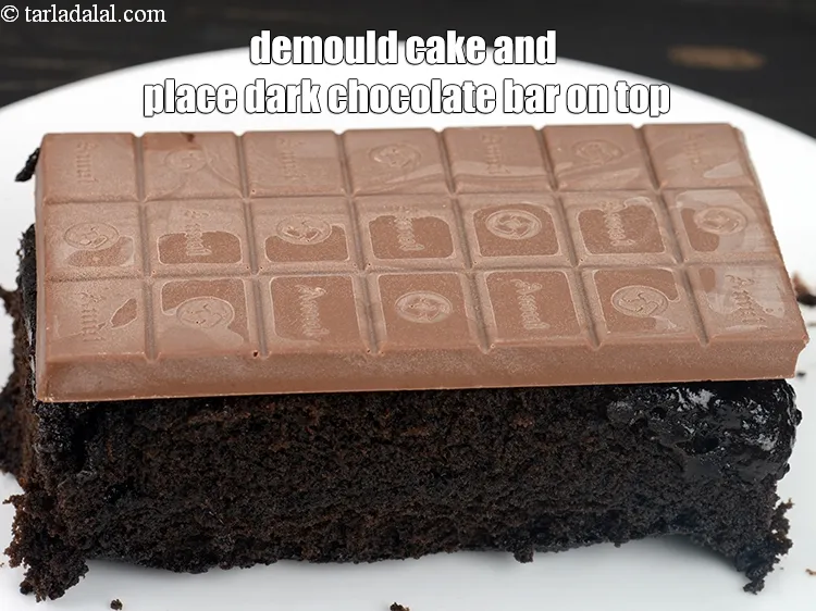 Step 15 – Demould the cake and place the dark chocolate bar on top of the cake.