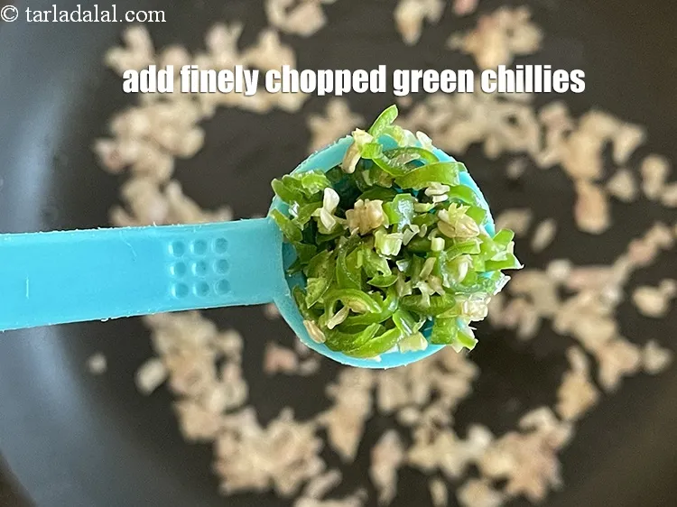 Step 24 – Add&nbsp;<meta charset="UTF-8" />1/2 tsp&nbsp;finely&nbsp;<a href="glossary-chopped-green-chilli-820i">chopped green chillies</a>.