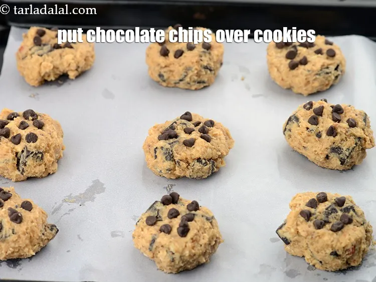 Step 15 – Put little chocolate chips evenly over each cookie.&nbsp;