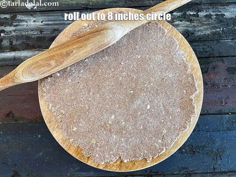 Step 15 – Roll out a portion into a 200 mm. (8 &quot;) diameter circle.