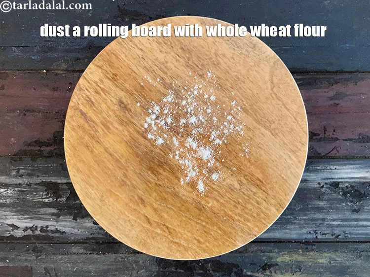 Step 17 – Dust a rolling board with whole wheat flour.