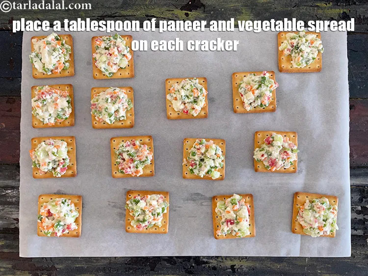 Step 16 – Place a tbsp of paneer and veggie spread on each cracker.
