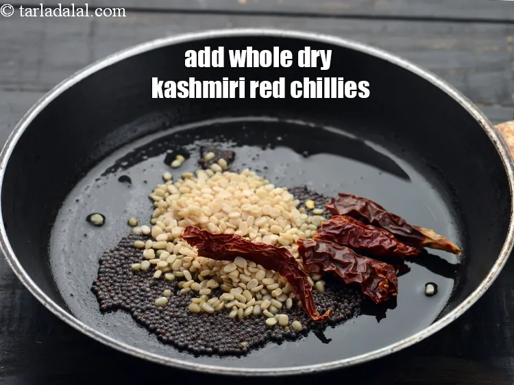 Step 16 – Add 2&nbsp;<a href="https://www.tarladalal.com/glossary-whole-dry-kashmiri-red-chillies-kashmiri-mirch-kashmiri-lal-mirch-332i">whole dry kashmiri red chillies</a>&nbsp;, broken.&nbsp;