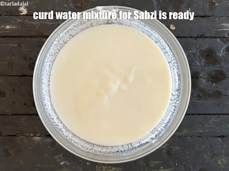 Step 15 – <p>Curd water mixture for the sabzi is ready.</p>