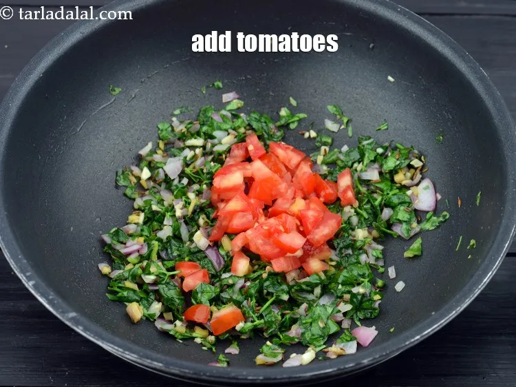 Step 15 – Add 1/4 cup&nbsp;<a href="https://www.tarladalal.com/glossary-chopped-tomatoes-779i">chopped tomatoes</a>.&nbsp;
