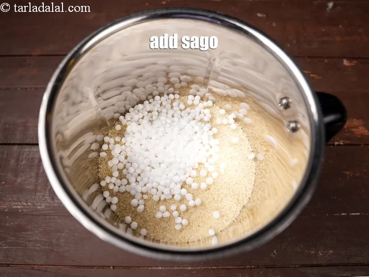 Step 16 – Add 2 tbsp <a href="https://www.tarladalal.com/glossary-sago-sabudana-605i">sago (sabudana)</a>.