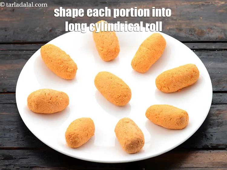 Step 15 – Shape each portion into a 50 mm. (2&quot;) long cylindrical roll. Keep aside.