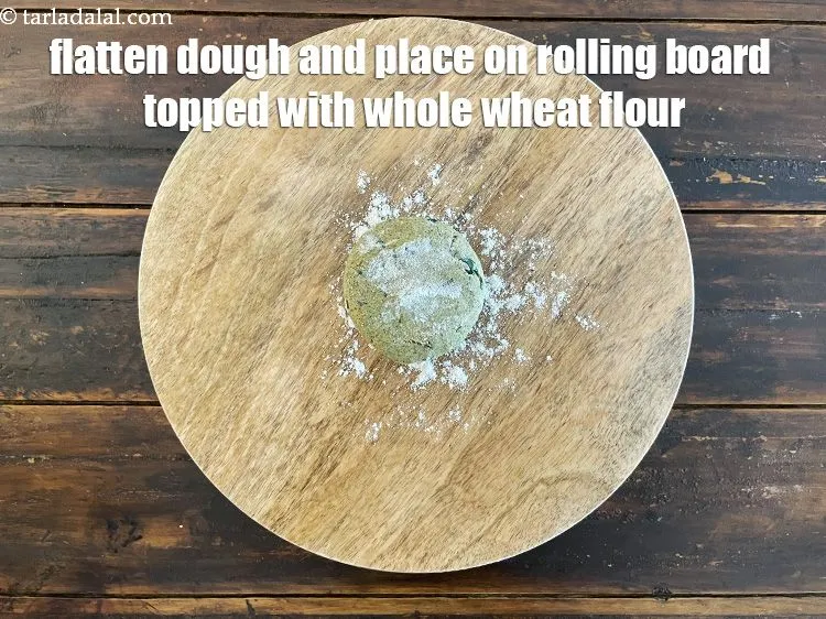 Step 36 – Sprinkle a little flour on the rolling surface.&nbsp;Flatten the dough between your palms and place …