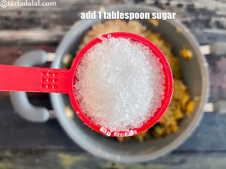 Step 21 – Add&nbsp;<meta charset="UTF-8" />1 tbsp&nbsp;<a href="glossary-sugar-chini-shakkar-278i">sugar</a>. This gives a nice sweetness to the khicdhi.