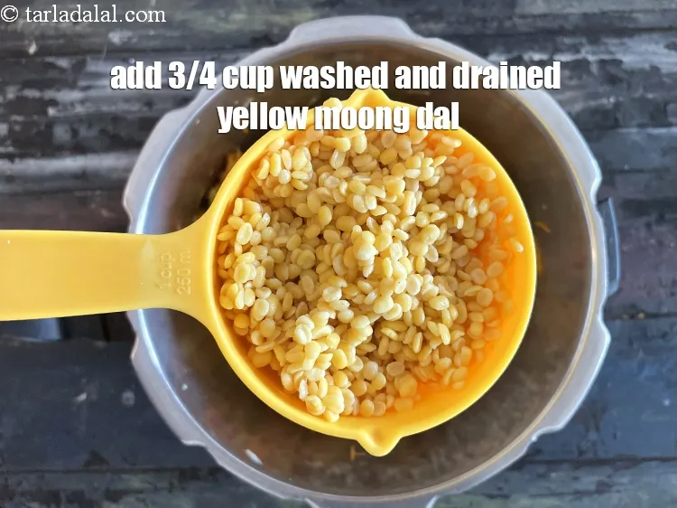 Step 24 – Add&nbsp;<meta charset="UTF-8" />3/4 cup&nbsp;<a href="glossary-yellow-moong-dal-split-yellow-gram-peeli-moong-dal-488i">yellow moong dal (split yellow gram)</a>&nbsp;, washed and drained.