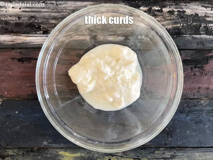 Step 17 – In a bowl put&nbsp;<meta charset="UTF-8" />3/4 cup&nbsp;<a href="glossary-thick-curds-2097i">thick curds (dahi)</a>.