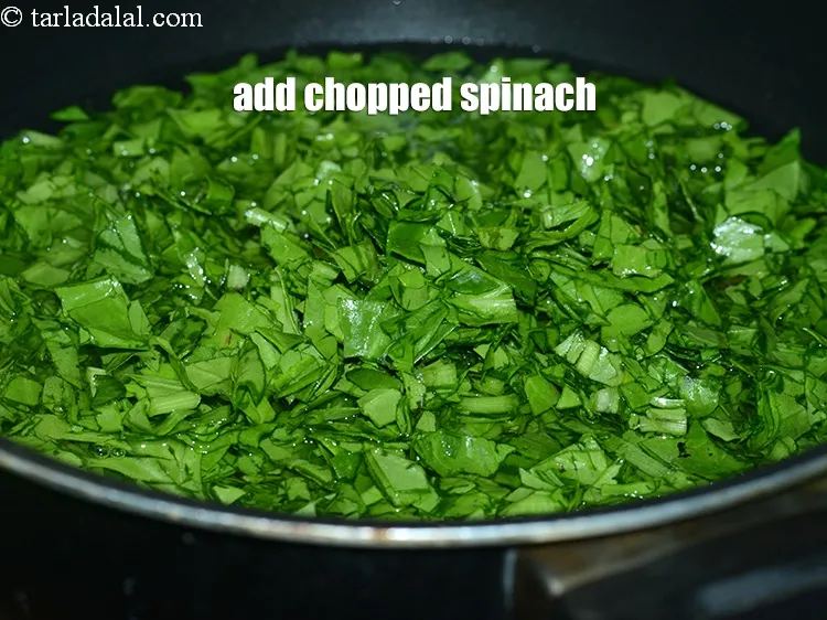 Step 16 – Add 3 cup <a href="https://www.tarladalal.com/glossary-chopped-spinach-780i">chopped spinach (palak)</a>.