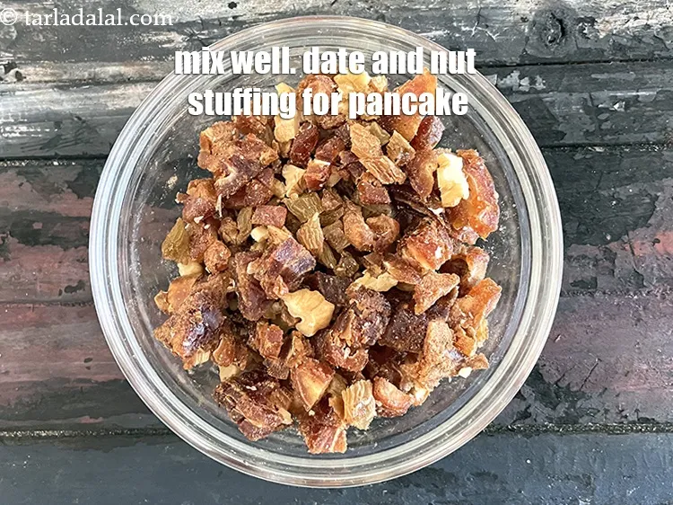 Step 17 – Mix well and keep aside. Your date and nut stuffing for eggless date pancake is …