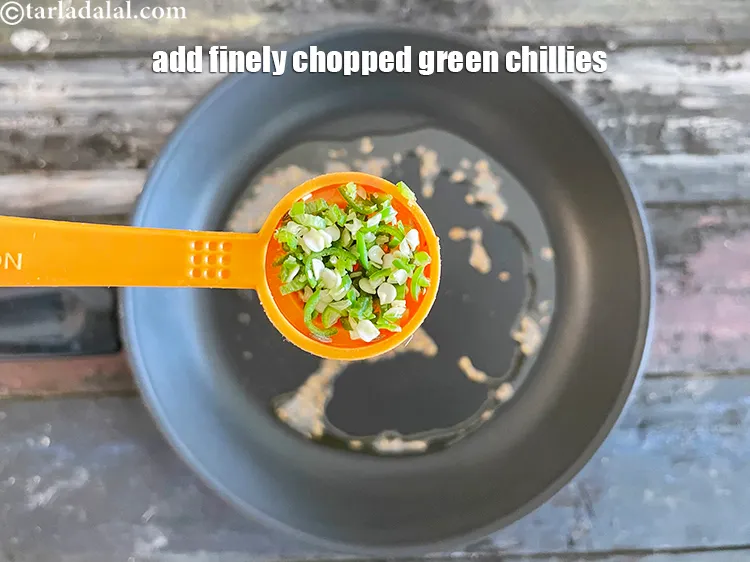 Step 14 – Add&nbsp;<meta charset="UTF-8" />1 tsp&nbsp;finely&nbsp;<a href="glossary-chopped-green-chilli-820i">chopped green chillies</a>.