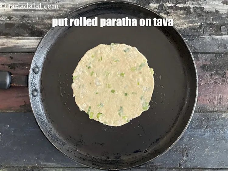 Step 18 – Put rolled paratha on tava.