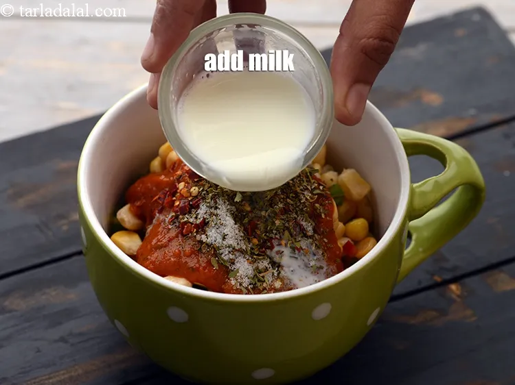 Step 15 – Add 1&frac12; tbsp <a href="https://www.tarladalal.com/glossary-milk-doodh-full-cream-milk-514i">milk</a>.