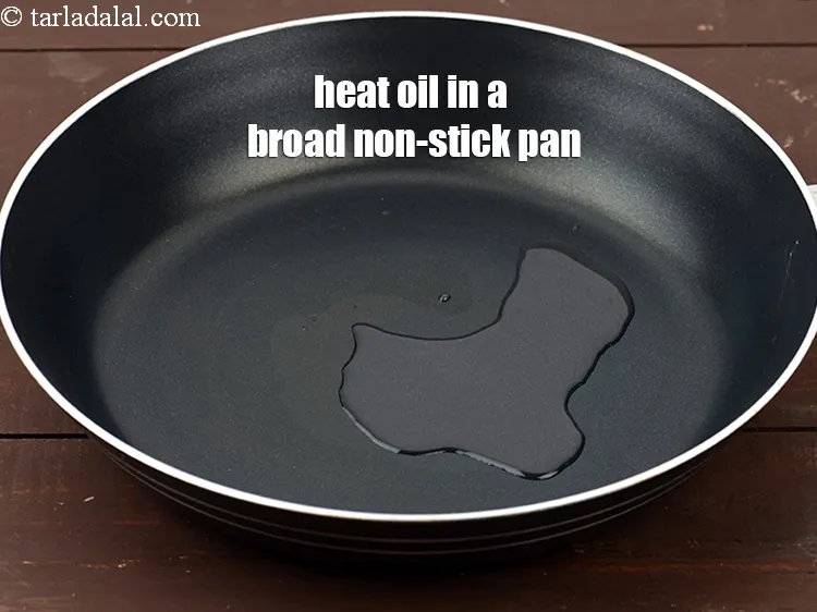 Step 17 – For the&nbsp;<strong>matar&nbsp;</strong><strong>paneer curry</strong>, heat 2 tsp <a href="https://www.tarladalal.com/glossary-oil-671i">oil</a> in a broad non-stick pan.