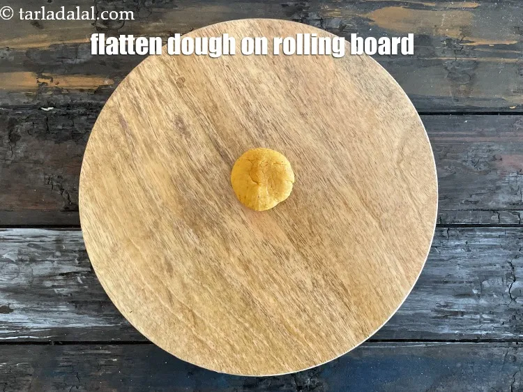 Step 15 – Flatten the dough with your plams on place on a rolling board.
