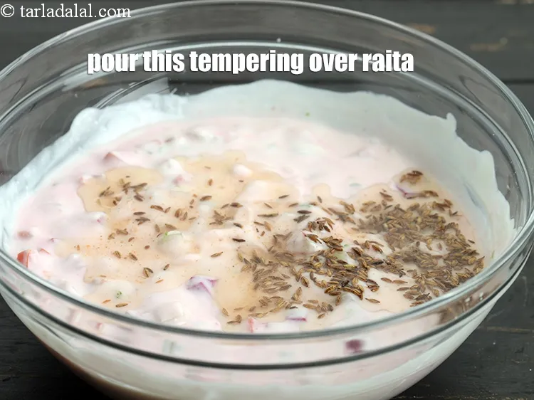 Step 15 – Pour this tempering over the raita.