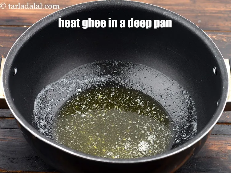 Step 16 – To make rajma chawal, heat the <a href="https://www.tarladalal.com/glossary-ghee-245i">ghee</a> in a deep non-stick pan.