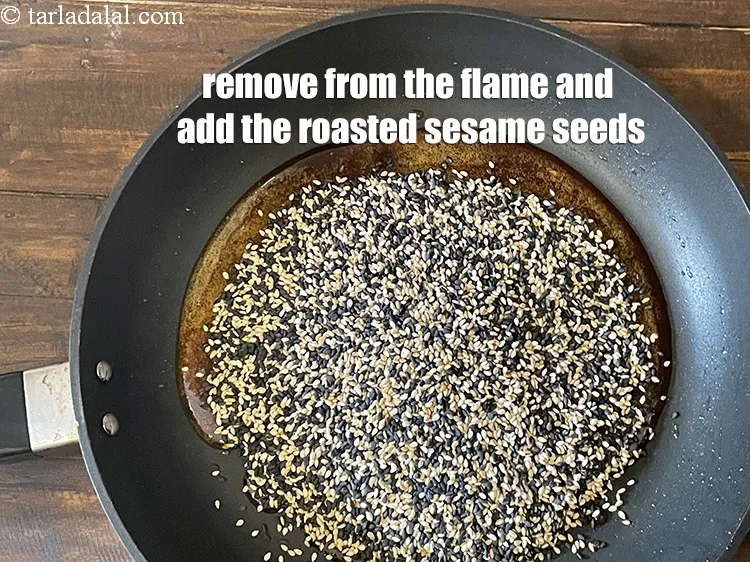 Step 15 – Remove from the flame.&nbsp;Add the roasted sesame seeds .