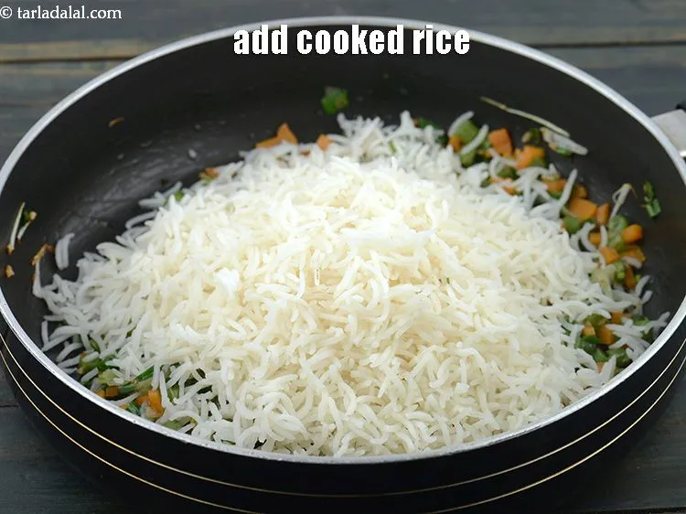 Step 25 – Add 3 1/2 cups&nbsp;<a href="https://www.tarladalal.com/cooked-chinese-rice-4182r">cooked rice</a>.&nbsp;